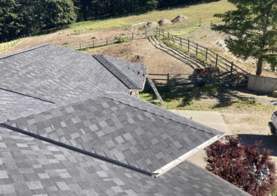 Stormproof Roofing grey roof many angles farm 2024