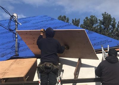 Storm Proof Roofing putting up plywood